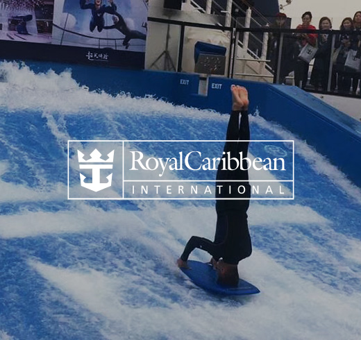 man doing headstand on surfboard