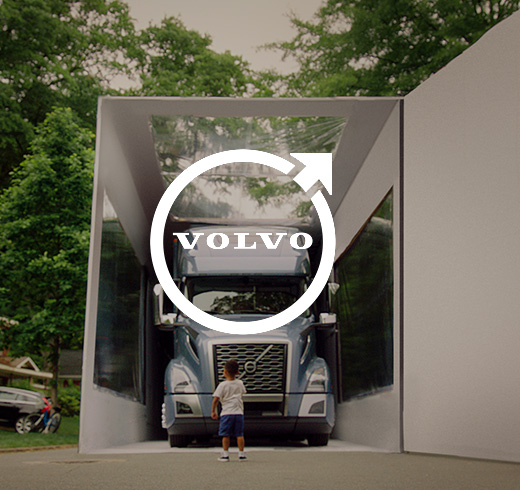 Volvo - man in front of Volvo truck