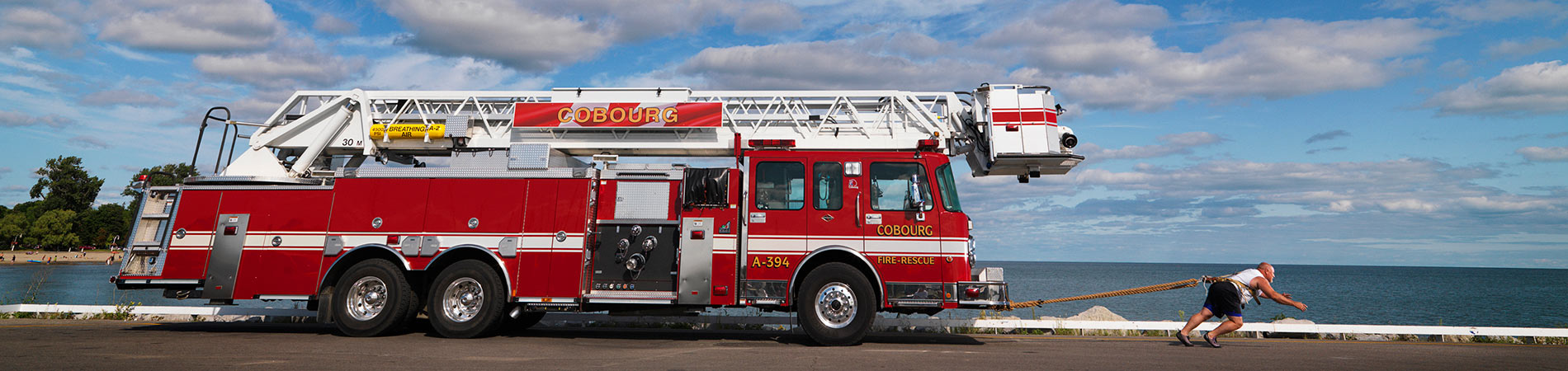 man pulling a heavy vehicle